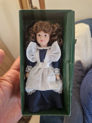 Vintage porcelain doll in maid style, like new