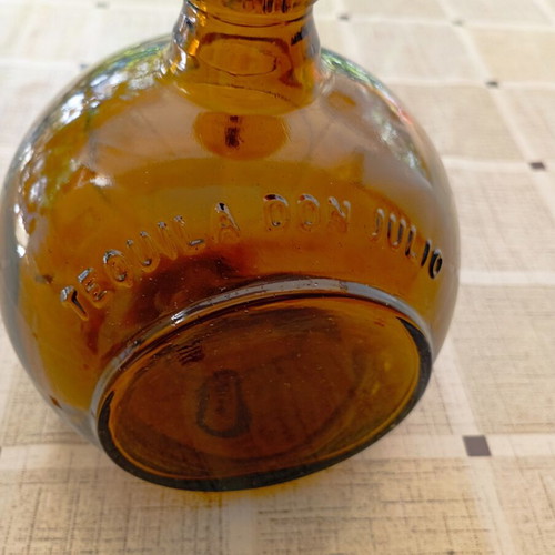 Don Julio Anejo tequila round collectible bottle, amber glass