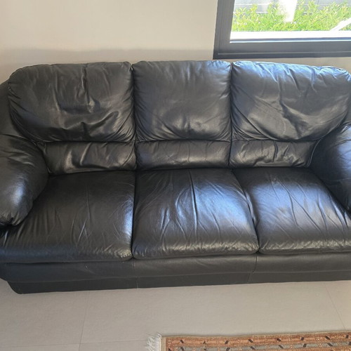 Leather three-seater sofa