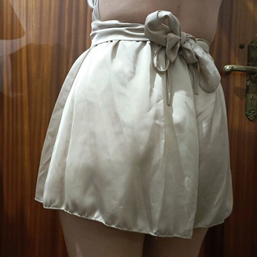 One-piece mini romper like new, gold with crisscross back