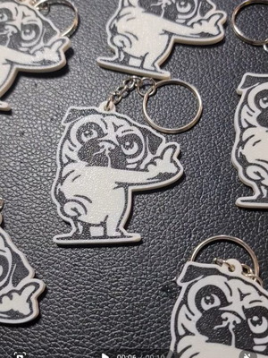 Pug keychain with middle finger gesture