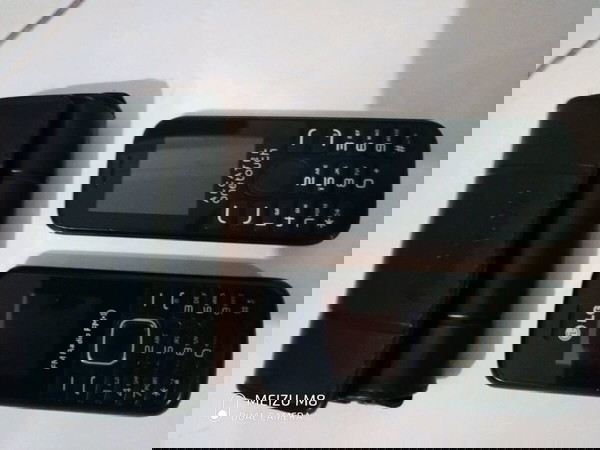 2 κινητα ΑLCATEL onetouch και LG(FM Radio)λειτουργουν και θηκη