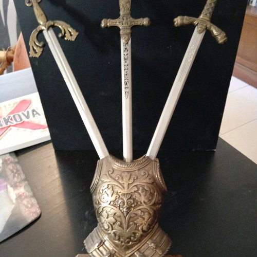 Decorative stand with sword letter openers used
