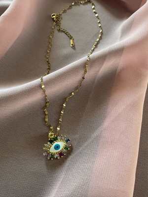 Amazing intact eye necklace made of stainless steel in gift packaging.