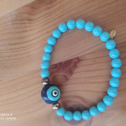 Bracelet with eye and blue beads new, fits all wrists
