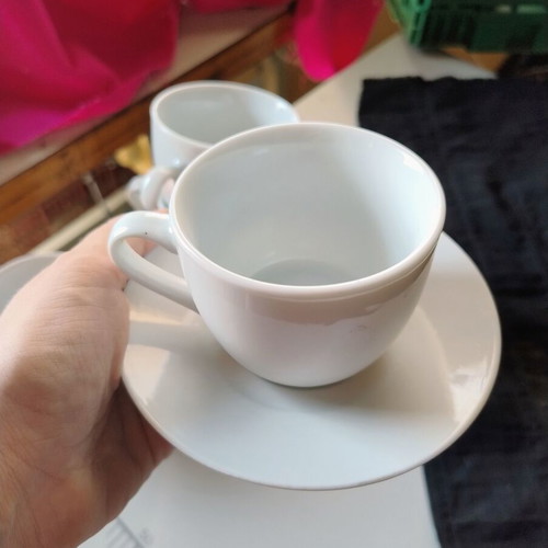 Set of 4 ceramic coffee cups with saucers
