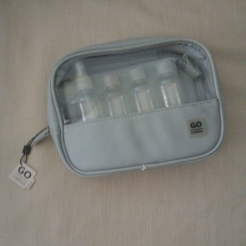 Travel toiletry bag like new with four 100ml containers and small pouch