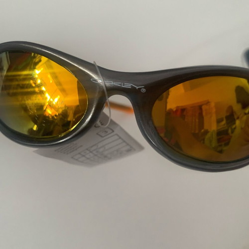 Oakley sunglasses, orange with gold lime chameleon lenses
