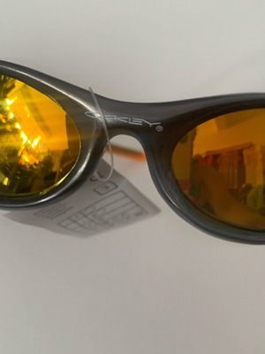 Oakley sunglasses, orange with gold lime chameleon lenses