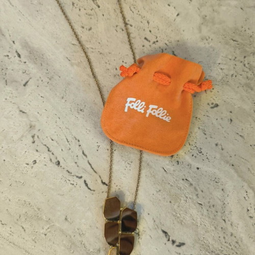 Folli Follie long necklace like new, gold tone with geometric detail and strass