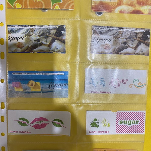 Sugar packet collection, 69 in holders plus 5 loose