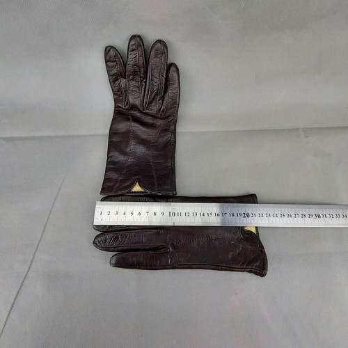 Women's dark brown leather gloves used