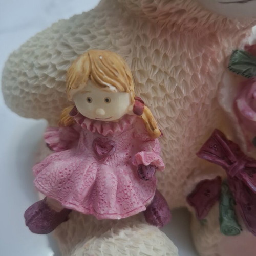 Collectible teddy bear with doll and roses, like new