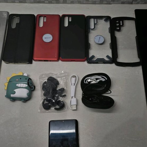 Huawei P30 Pro used with 5 cases, 2 headphones, charger, and box