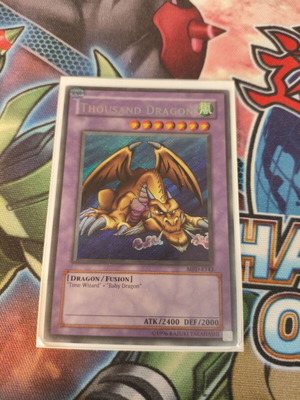 Thousand Dragon Yu-Gi-Oh card used, Secret Rare, MRD edition, damaged