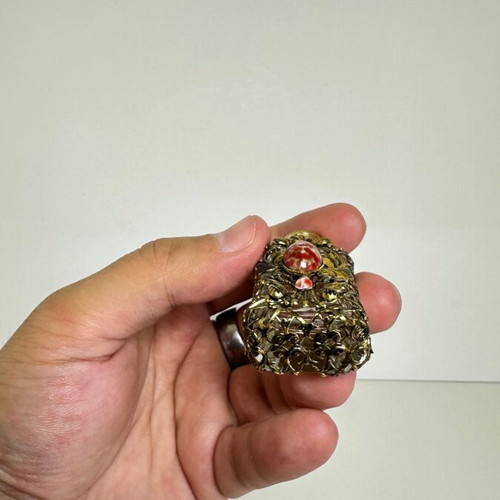 Vintage perfume flacon with filigree metalwork and red cabochon