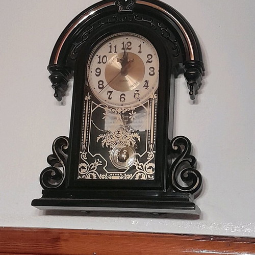Antique wall clock hanging used