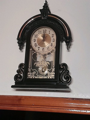 Antique wall clock hanging used