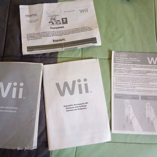 Nintendo Wii black used with Wii Motion Plus controller, nunchuk and 2 games