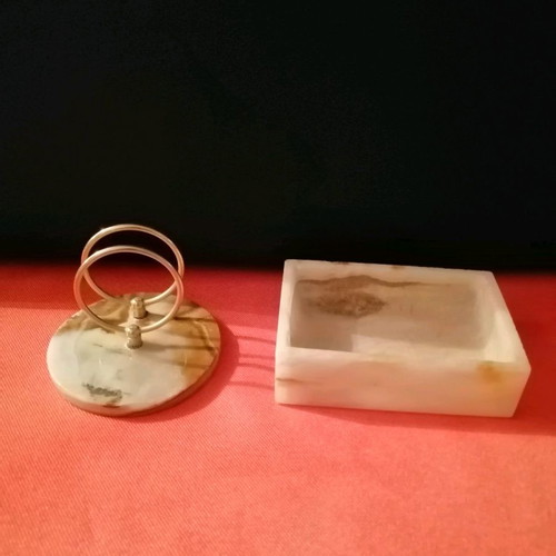 Envelope stand and alavastrine pouch.