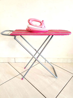 Toy ironing board with light-up iron that plays music like new