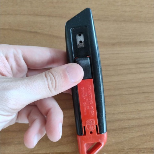 Utility knife with blade and spring used