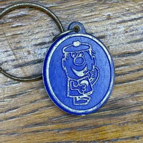 Vintage promotional keychain used from Dutch company