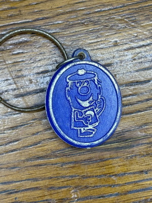 Vintage promotional keychain used from Dutch company