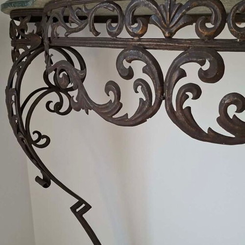Metal console used with marble top and ornate wrought iron design