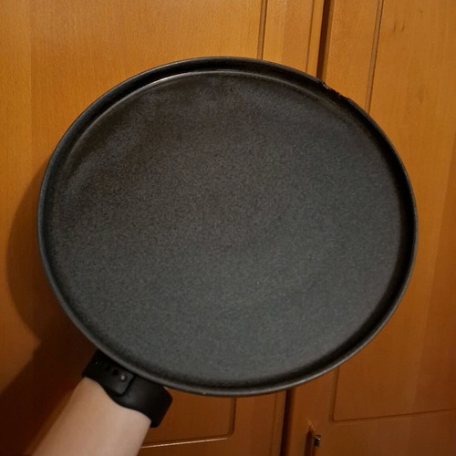 Porcelain plate used, black with small chip