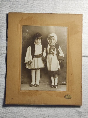 Photograph of siblings with traditional costumes used