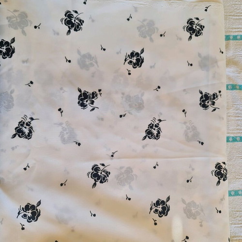 White fabric with black flowers for dress