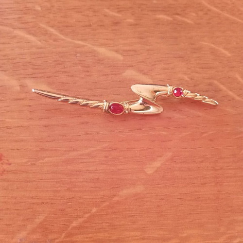Vintage lightning bolt brooch with red stones, like new