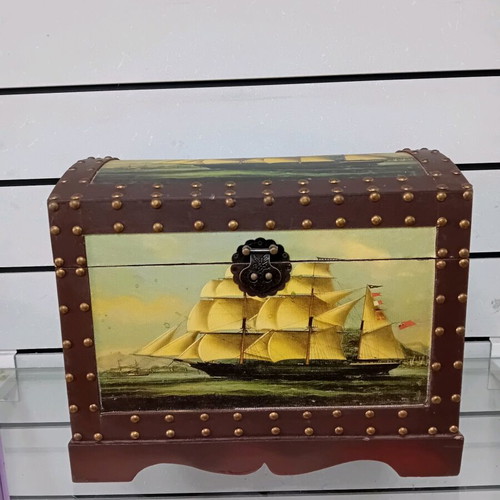 Small trunk used with ship decor and leather handles