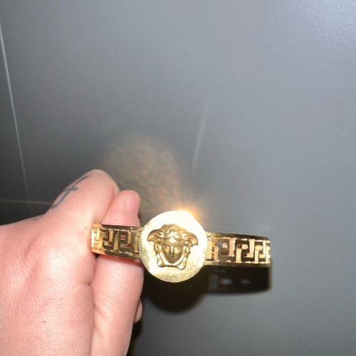 Versace gold hand bracelet like new