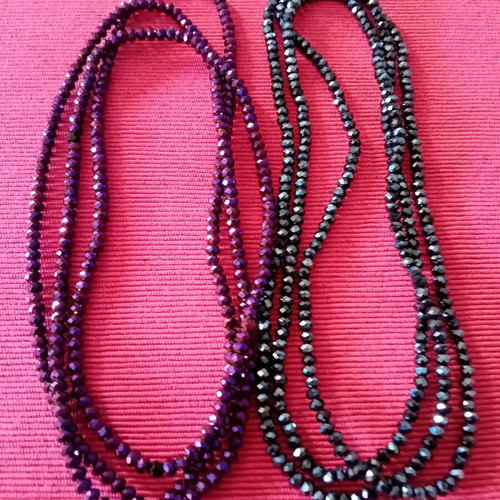 Package. Two long necklaces, in two shades.
