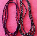 Package. Two long necklaces, in two shades.