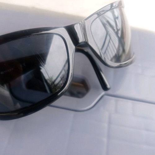 Vogue sunglasses used, black with scratch on lens