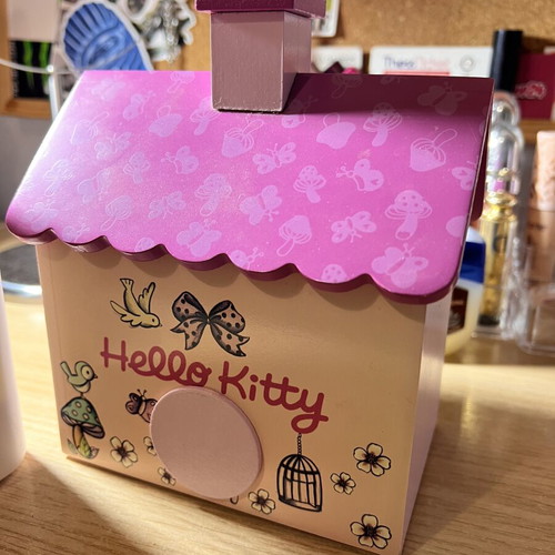 Sanrio Hello Kitty Wooden Piggy Bank like new with mirror