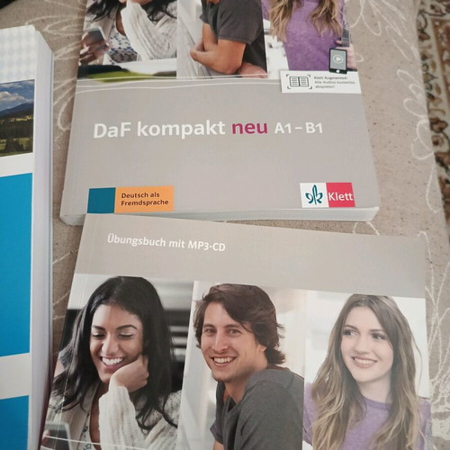 Three German language learning books like new with CD