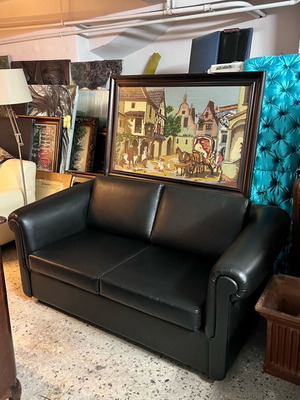 Two-seater sofa bed like new with leather upholstery, black