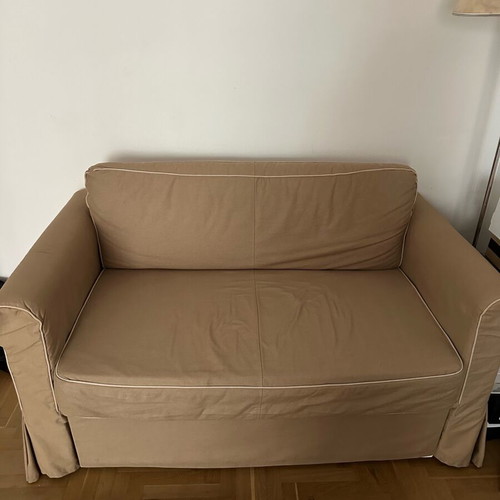 Beige two-seater sofa bed like new with storage space