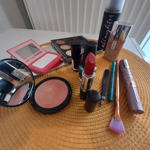 Set of used cosmetics with new Maybeline Sky High mascara