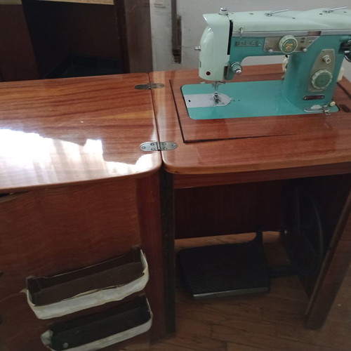 Ideal sewing machine used, foot-powered with motor, wooden cabinet