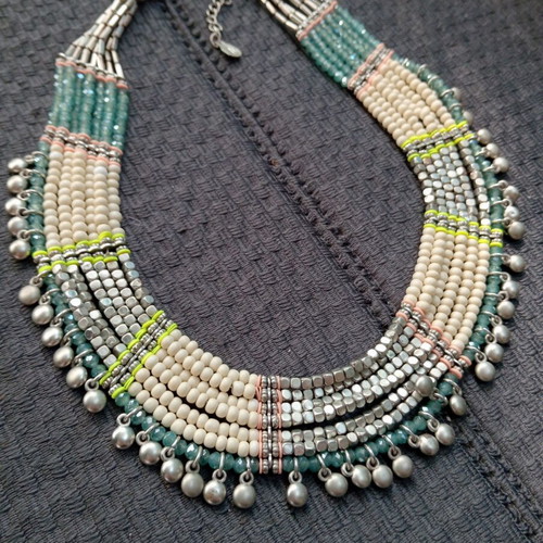 Accessorize multistrand necklace with plastic and glass beads