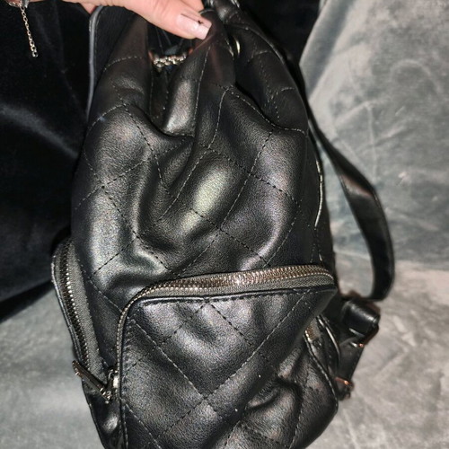 Backpack used, black with multiple pockets