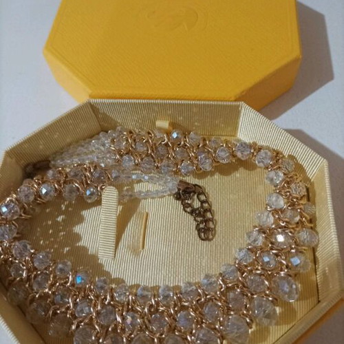 Women's evening necklace like new with gold weave and white stones