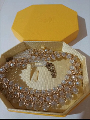 Women's evening necklace like new with gold weave and white stones