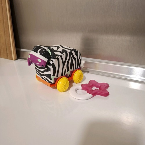Luna fabric animal with wheels and teether star like new
