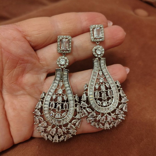 Long silver plated earrings with zircon stones